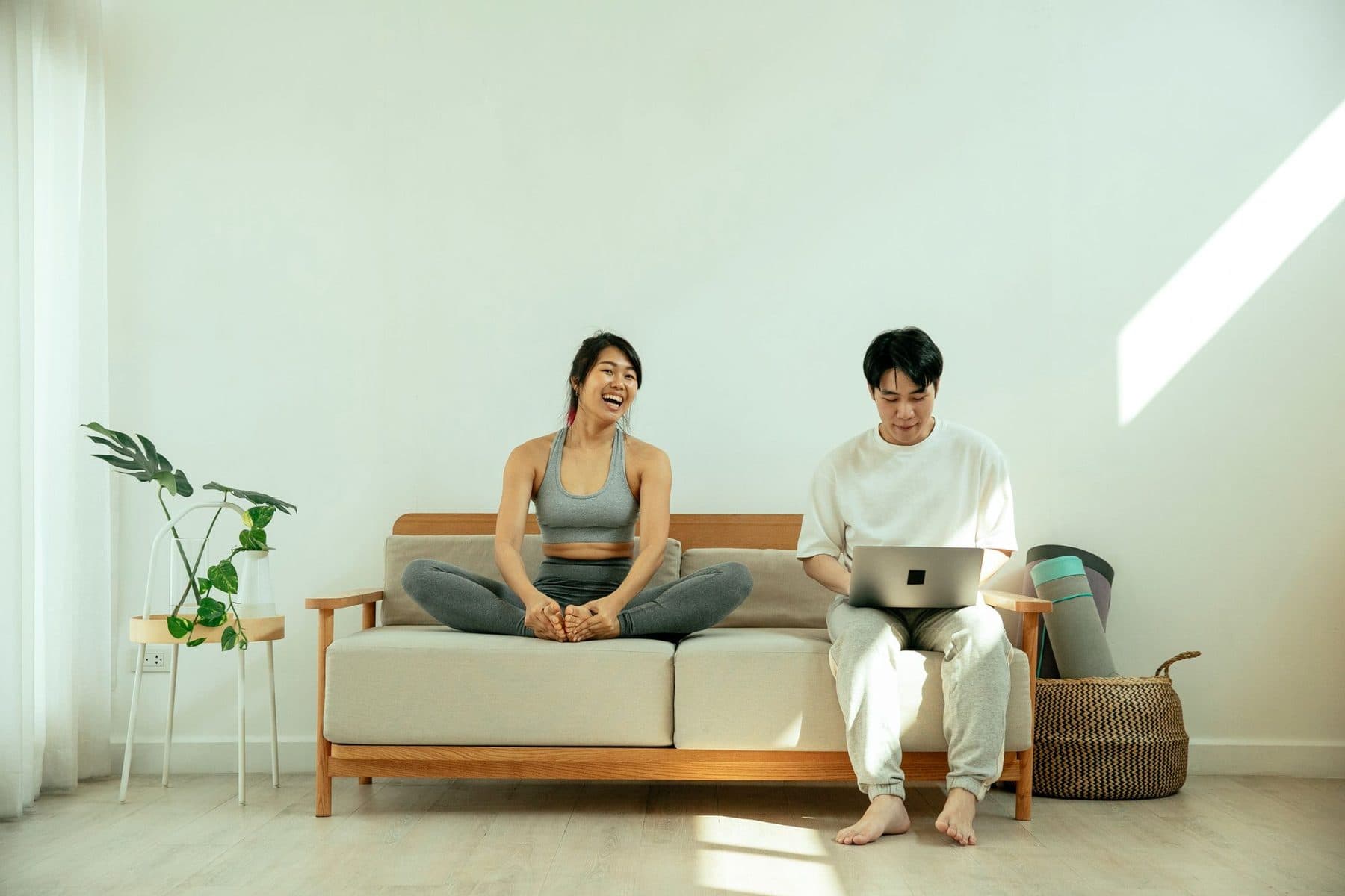 Young couple on a sofa with a laptop